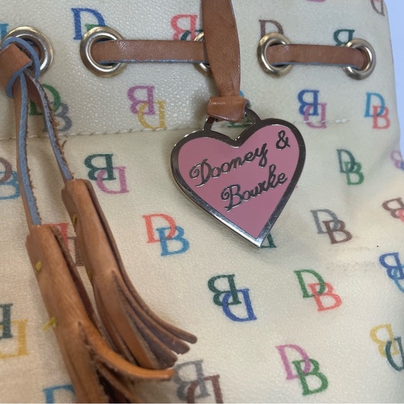 Dooney & Bourke Cream Satchel Bag pre-owned. Strap has stain. - Picture 2 of 16